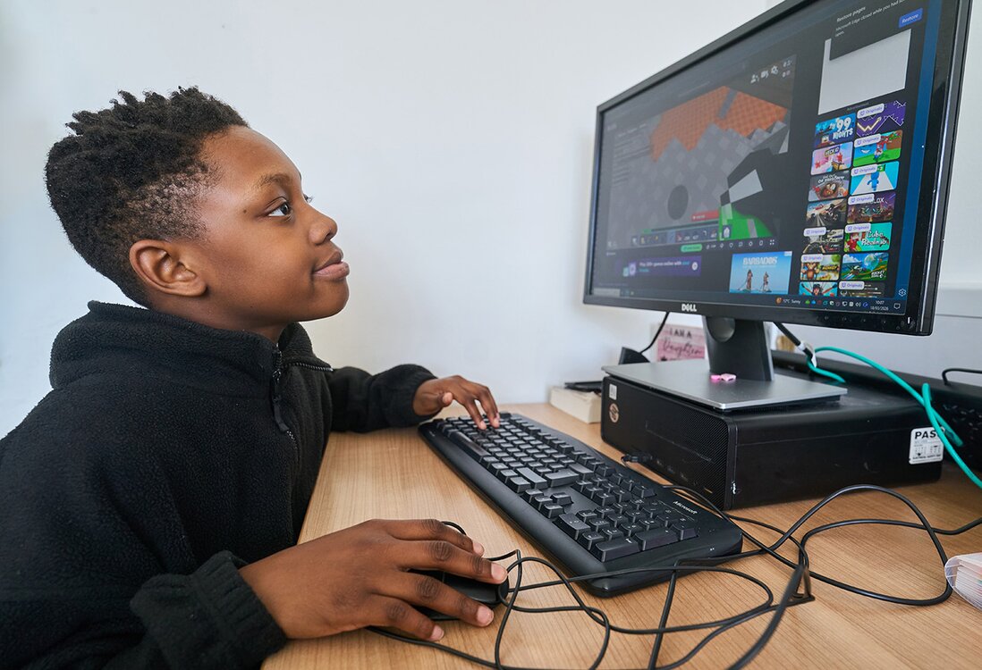 pupil works at a computer