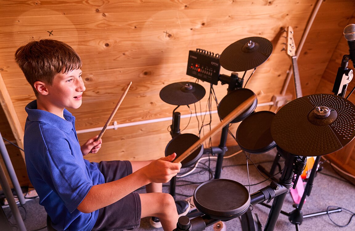 child playing drum kit