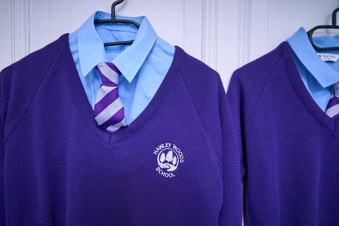 Purple school uniform hanging up