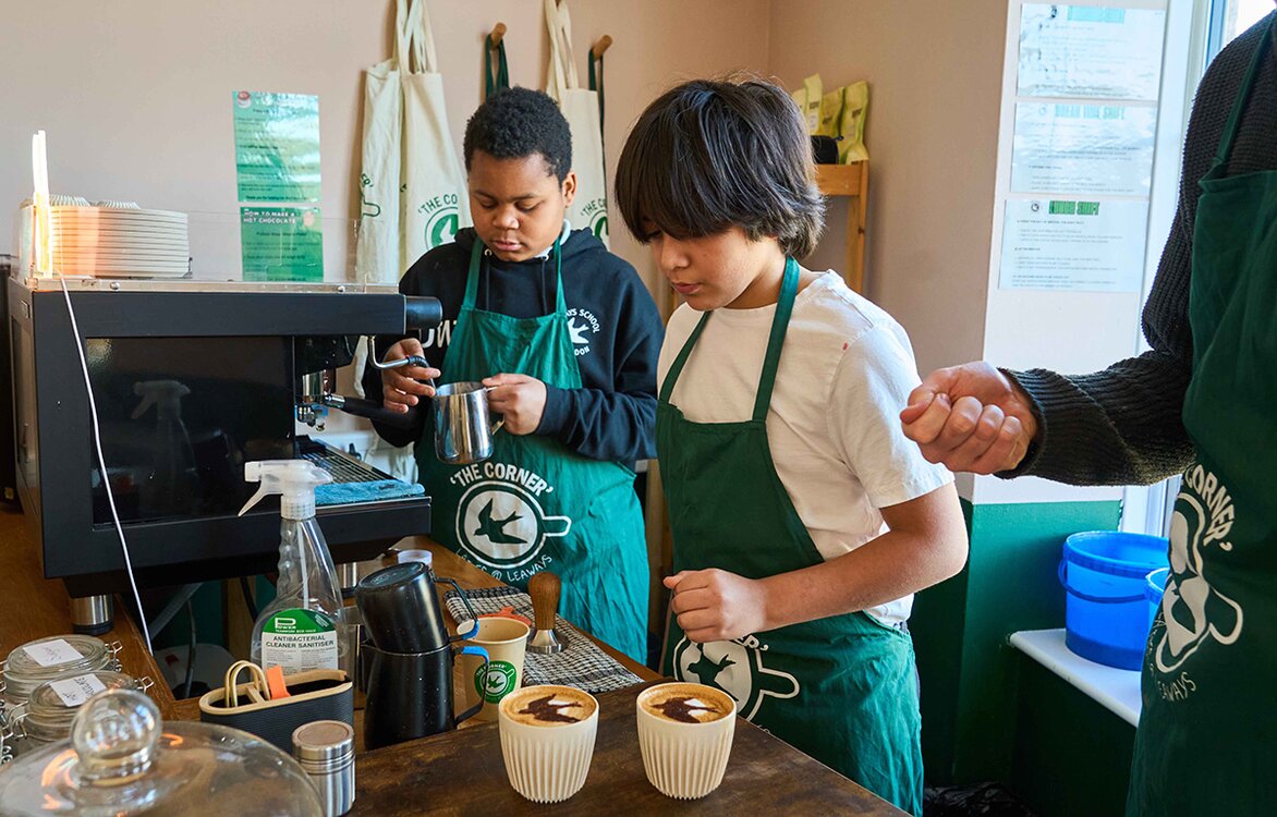two pupils making barista coffee