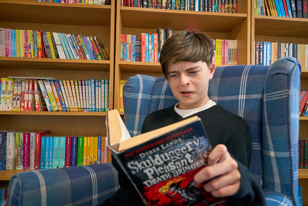 student reading a book