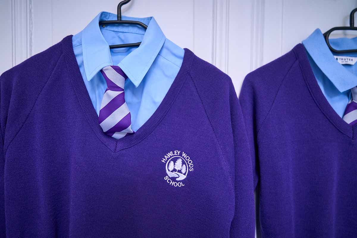 Purple school uniform hanging up