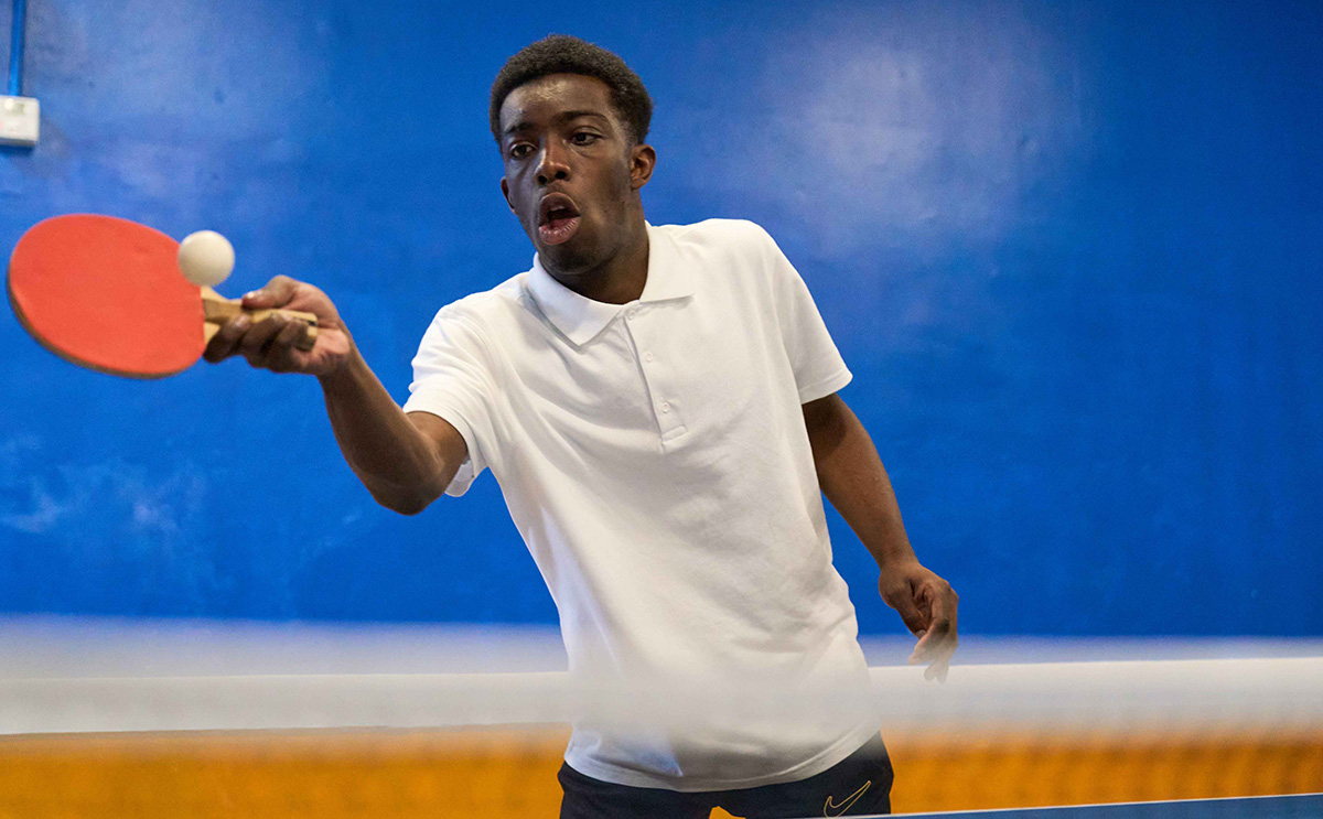 child playing table tennis