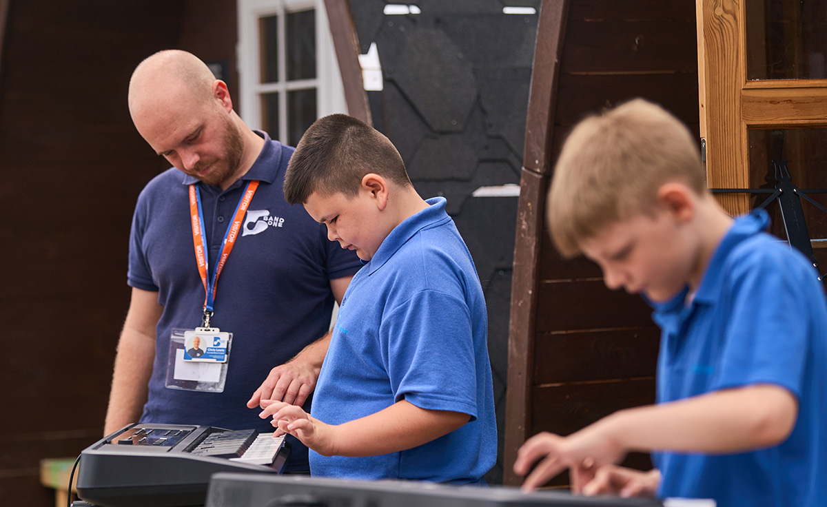 children playing musical keyboards