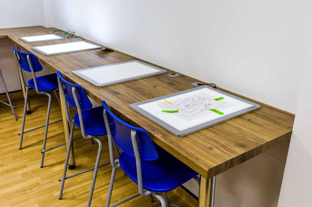 a row of light boxes in the art studio