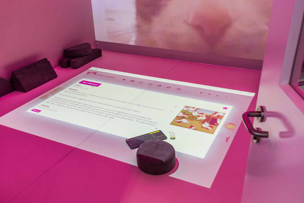 projected image on floor and walls of immersive room
